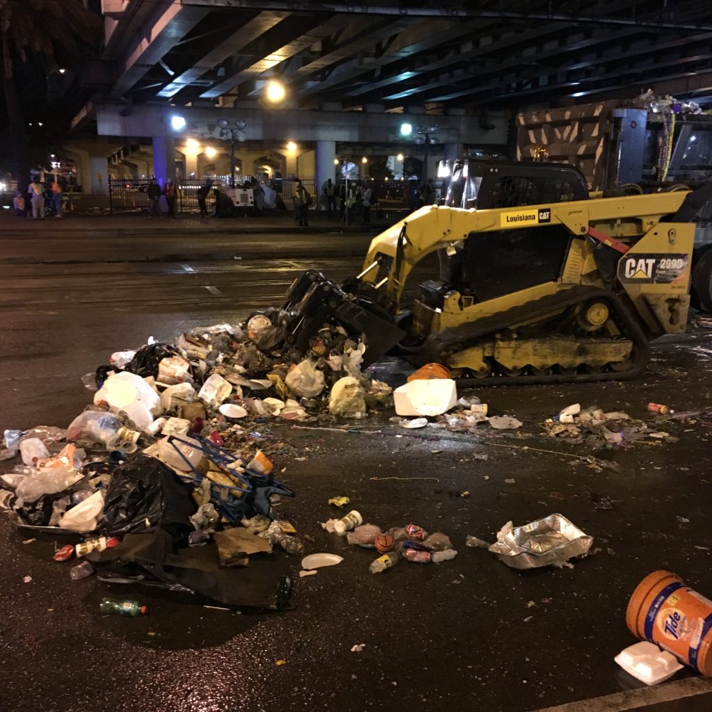 Road trash being cleaned by machinery