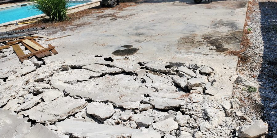 Poolside concrete being demolished