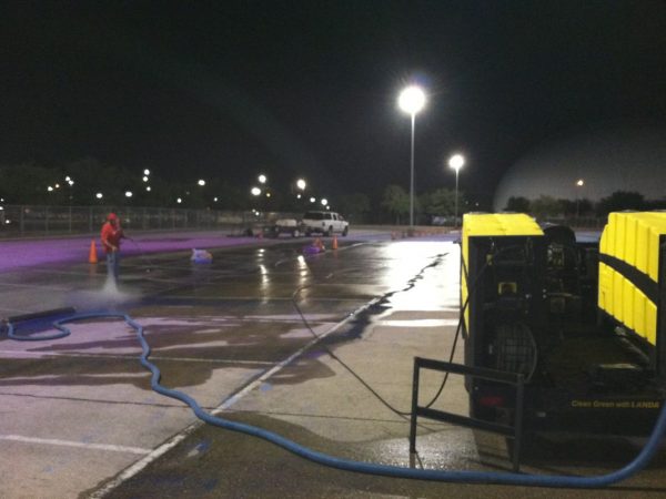 Parking lot being sprayed clean